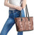 Hawaii Maile Lei Leather Tote Bag With Brown Monstera Pattern